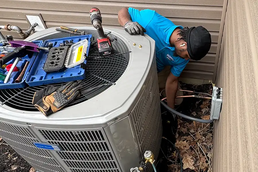 Outdoor heat pump undergoing professional repair to improve system performance