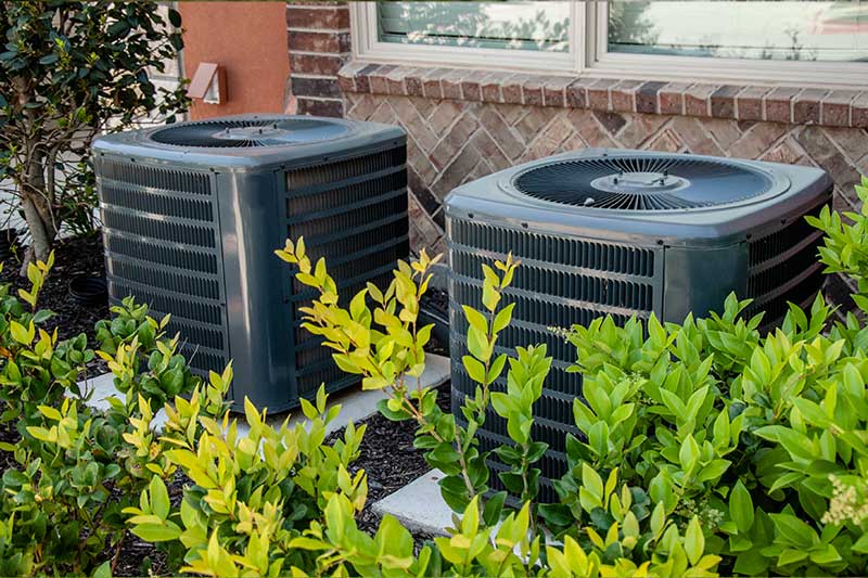 Outdoor AC units needing compressor repair in West Lafayette