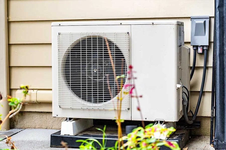Home mini split condenser inspected as part of ductless mini split maintenance