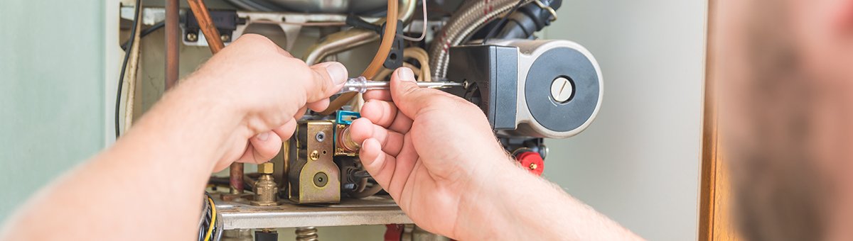 Technician Repairing Furnace